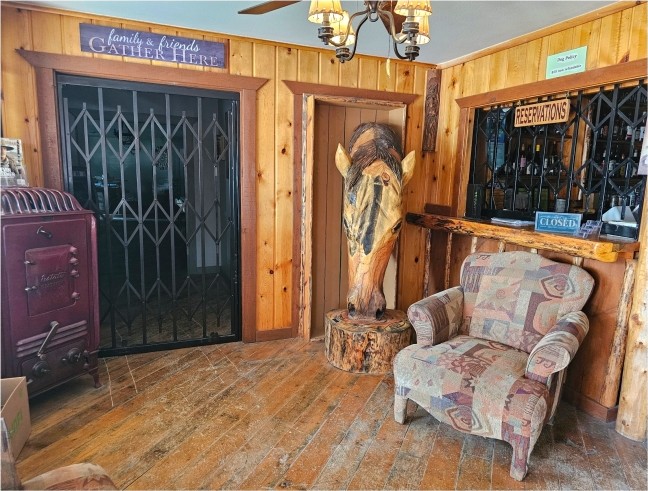Reception and lobby with hand-carved horse at Lincoln Log Hotel