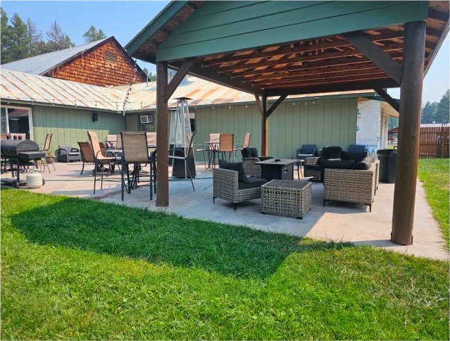 Covered patio pavilion with outdoor lounge seating